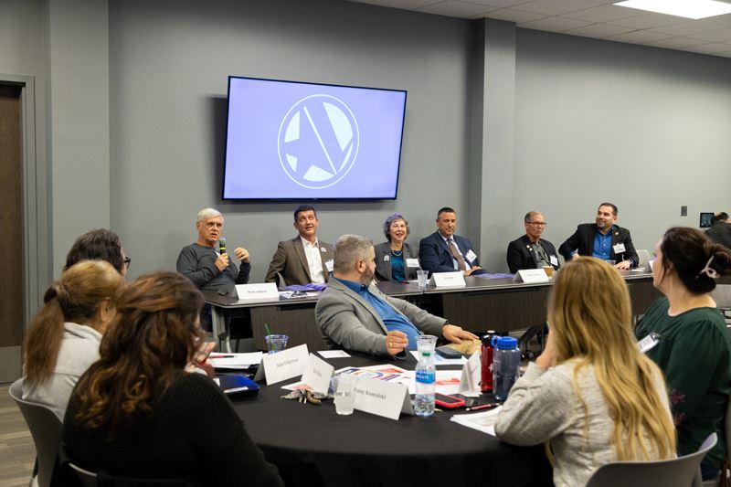 City Council members and city manager seated panel-style at a table