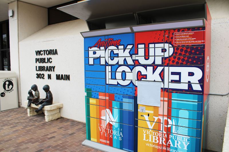 a large colorful locker that says Anytime Pick-Up Locker on it. 