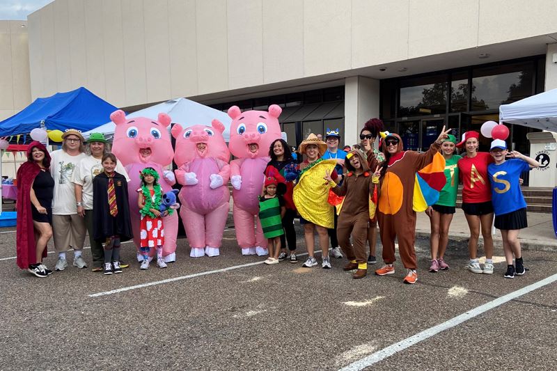 Costumed characters including three little pigs, frog and toad, Alvin and the chipmunks