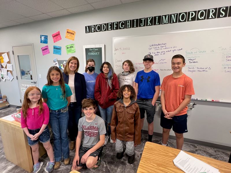 Group photo in classroom with kids and one adult