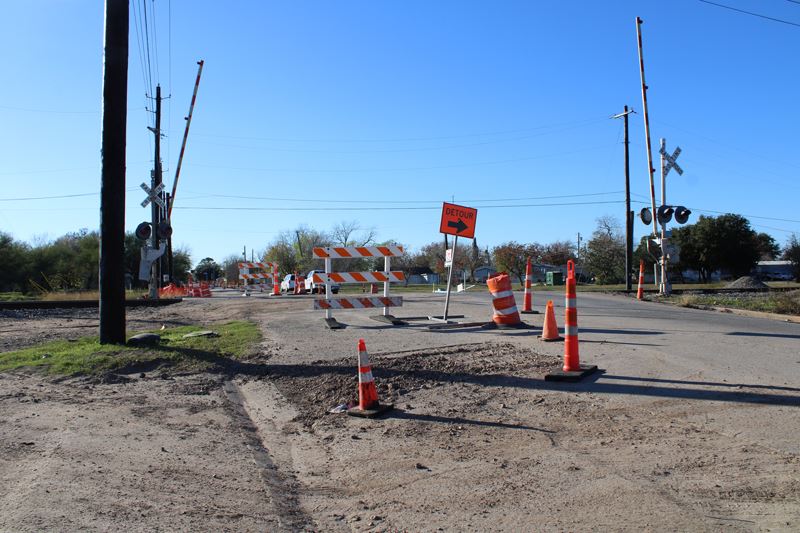 Traffic cones, barricades and a detour sign on Crestwood Drive